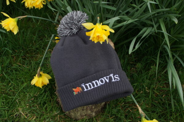 An Innovis breeding livestock branded bobble hat