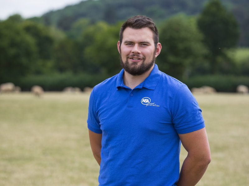 A UK livestock industry worker in a field