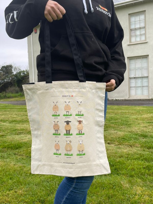 A canvas bag with sheep breeds printed on it